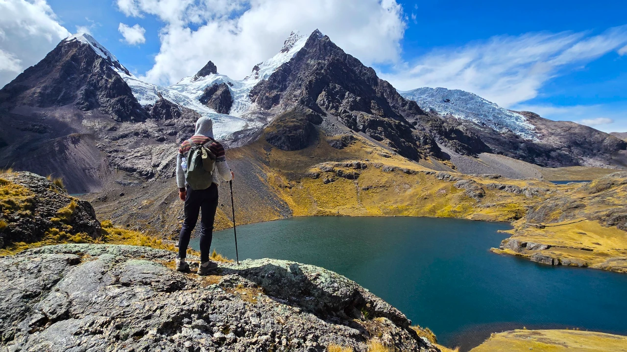 Hiker viewing the 7 lakes of Ausangate | Salkantay Lake